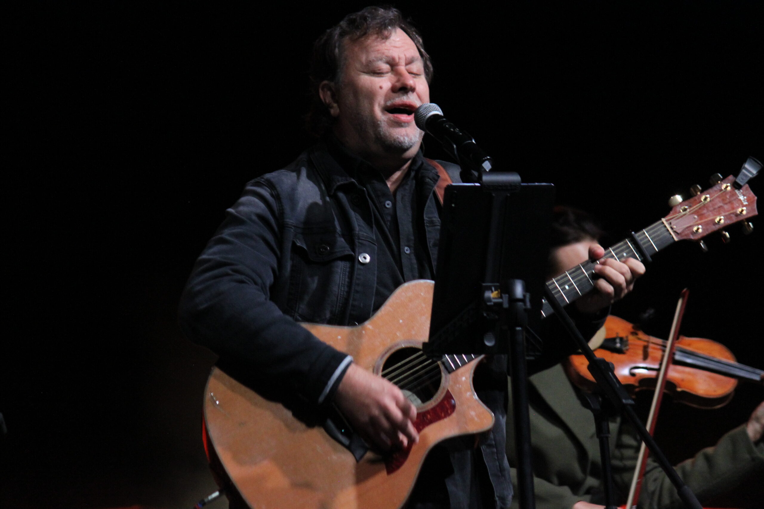 Louis Brittz performing on stage